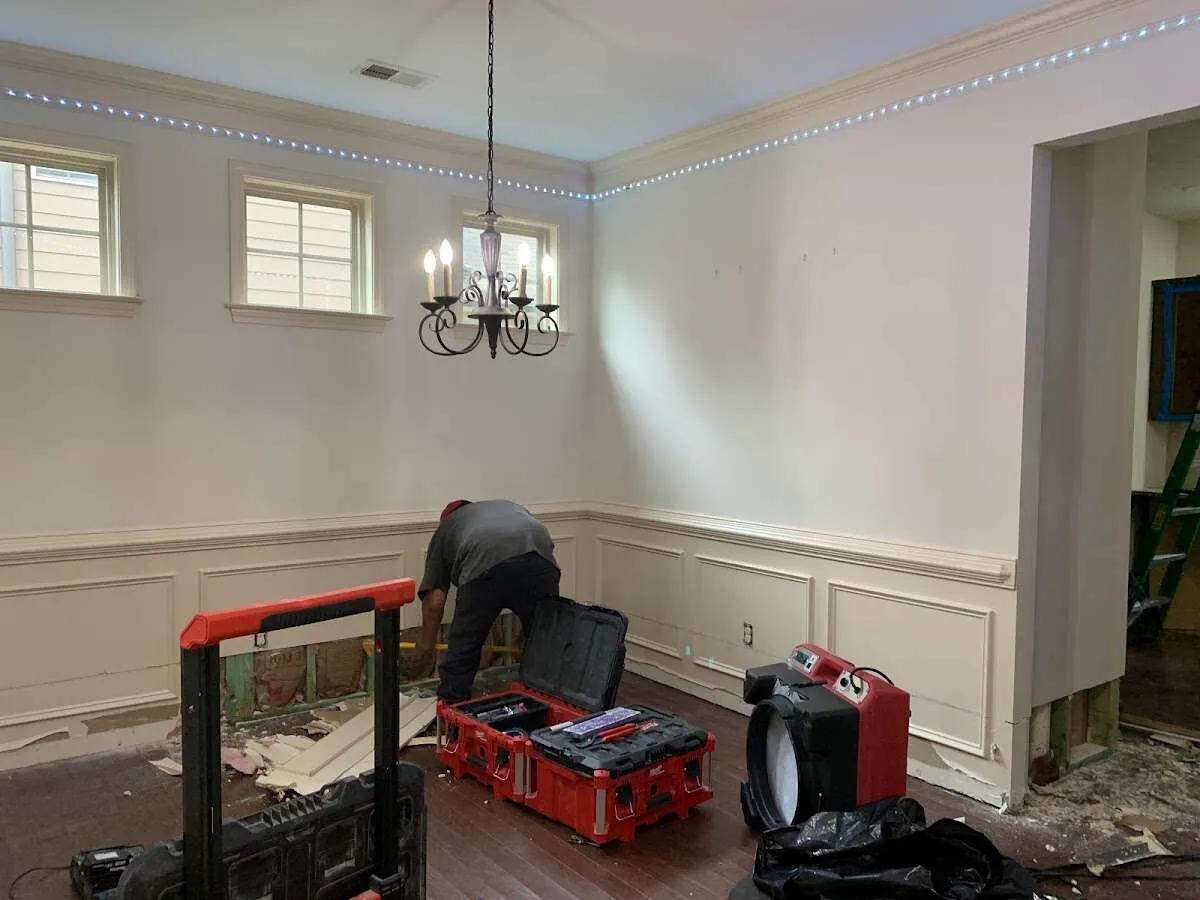 Restoration technician with professional equipment in Milford
